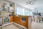 Kitchen with stainless steel appliances and breakfast bar